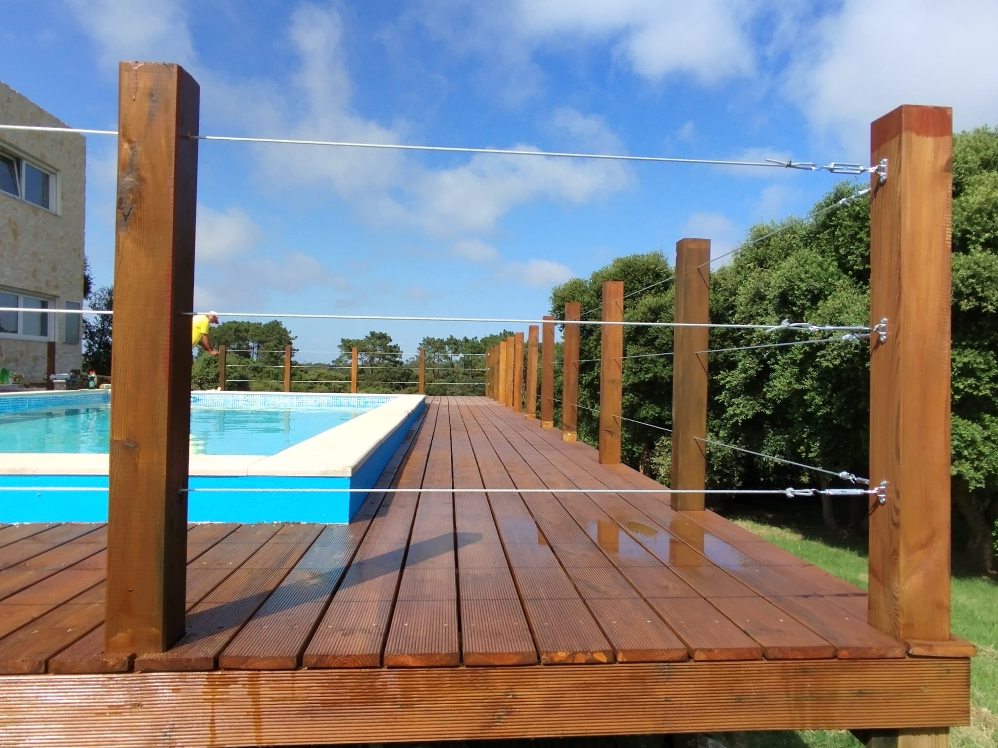 Finished hardwood pool deck with stainless steel cable balustrade overlooking the Silver Coast countryside