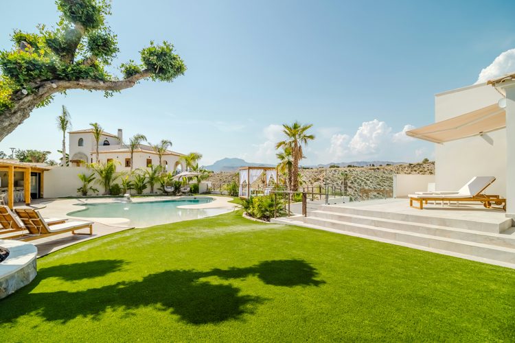 Weekly exterior inspection of a Silver Coast holiday home — front of villa, garden and pool area photographed for the owner's report